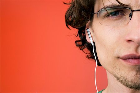 Portrait of a man with earphones Stock Photo - Premium Royalty-Free, Code: 6108-05873350