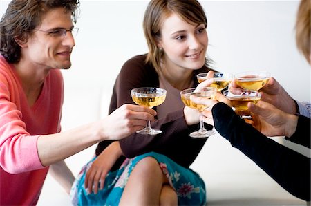 Couple and 3 people clinking glasses of champagne Stock Photo - Premium Royalty-Free, Code: 6108-05873374