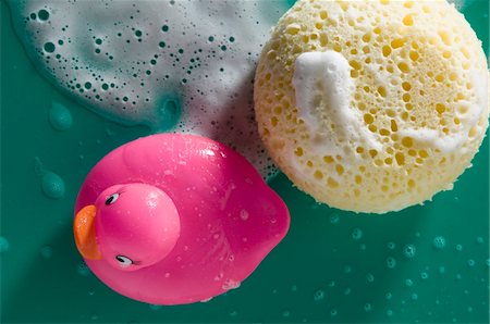 Rubber duck and sponge, close-up Stock Photo - Premium Royalty-Free, Code: 6108-05873495