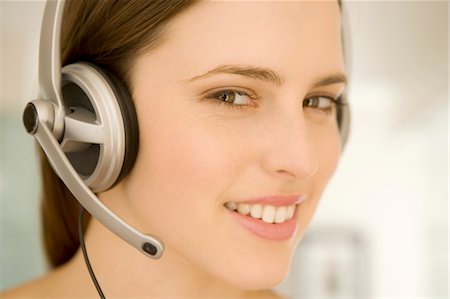 simsearch:6108-05873540,k - Portrait of a young woman, listening to music with headphones Stock Photo - Premium Royalty-Free, Code: 6108-05873539