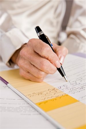 project (a specific task) - Mid section view of a woman filling out an application form Stock Photo - Premium Royalty-Free, Code: 6108-05873853
