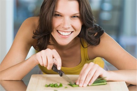 simsearch:6108-05863298,k - Woman chopping chives Stock Photo - Premium Royalty-Free, Code: 6108-05873937