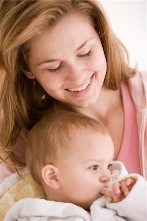 simsearch:6108-05863227,k - Woman smiling with her daughter Stock Photo - Premium Royalty-Free, Code: 6108-05874018