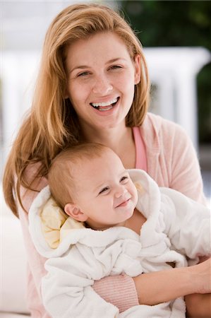 simsearch:6108-05863227,k - Woman smiling with her daughter Stock Photo - Premium Royalty-Free, Code: 6108-05874019