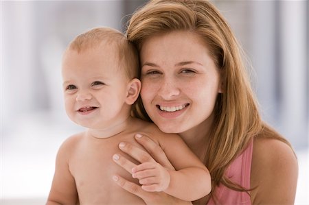 simsearch:6108-05863227,k - Woman holding her daughter Stock Photo - Premium Royalty-Free, Code: 6108-05874023