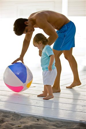 Man playing with his daughter Stock Photo - Premium Royalty-Free, Code: 6108-05874034