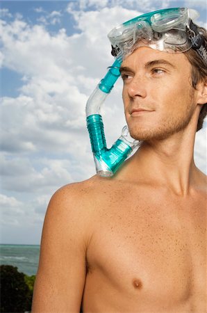 scuba beach - Man wearing a scuba mask Stock Photo - Premium Royalty-Free, Code: 6108-05874140