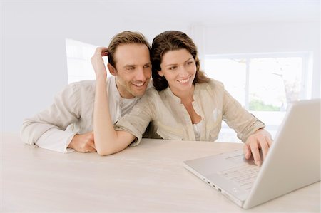 simsearch:6108-05860003,k - Couple working on a laptop Stock Photo - Premium Royalty-Free, Code: 6108-05874149