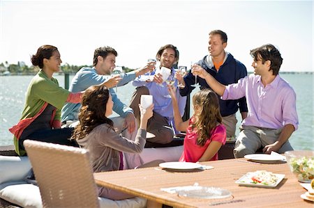 simsearch:6108-05857477,k - Friends toasting with drinks at a party Stock Photo - Premium Royalty-Free, Code: 6108-05874122