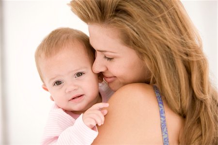 simsearch:6108-05863227,k - Woman holding her daughter Stock Photo - Premium Royalty-Free, Code: 6108-05874134