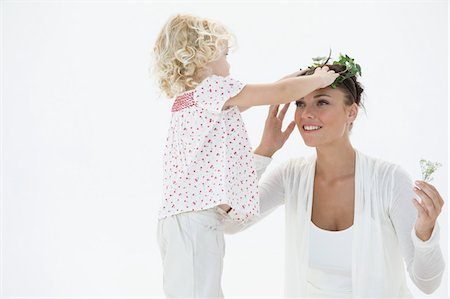 simsearch:6108-05865897,k - Girl putting a wreath on her mother's head Stock Photo - Premium Royalty-Free, Code: 6108-05874232