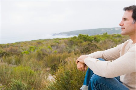 simsearch:6108-05874310,k - Man looking at sea view and thinking Stock Photo - Premium Royalty-Free, Code: 6108-05874308