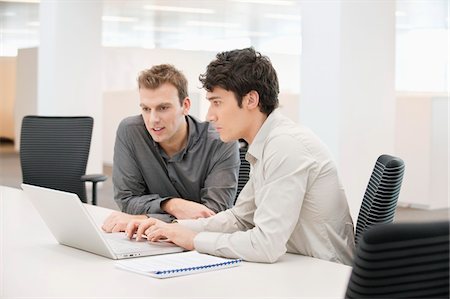 Two businessmen working in an office Stock Photo - Premium Royalty-Free, Code: 6108-05874693