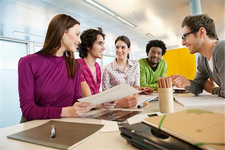 simsearch:6108-05868100,k - Business executives discussing in an office Stock Photo - Premium Royalty-Free, Code: 6108-05874718