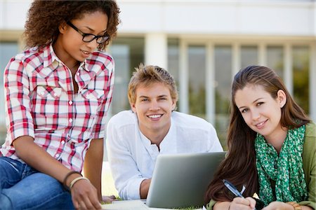 student with computer in campus - Friends studying in a campus Stock Photo - Premium Royalty-Free, Code: 6108-05874957