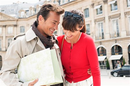 people of france shopping - Couple smiling on a street, Paris, Ile-de-France, France Stock Photo - Premium Royalty-Free, Code: 6108-05875167