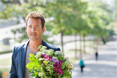 Man with a bouquet of flowers, Paris, Ile-de-France, France Stock Photo - Premium Royalty-Free, Code: 6108-05875185