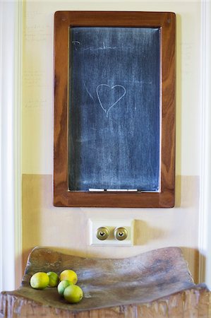 Details of blackboard with fruits kept on wooden stand Stock Photo - Premium Royalty-Free, Code: 6108-05875109