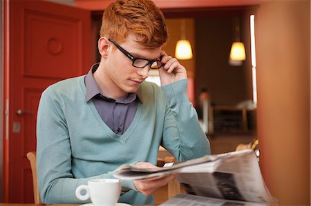 red hair men - Man reading a newspaper in a restaurant Stock Photo - Premium Royalty-Free, Code: 6108-06165969