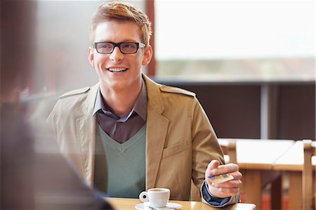 paying at restaurant - Man paying bill by credit card in a restaurant Stock Photo - Premium Royalty-Free, Code: 6108-06166084