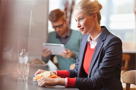 simsearch:6108-06166066,k - Businesswomen having lunch in a restaurant Stock Photo - Premium Royalty-Free, Code: 6108-06166088