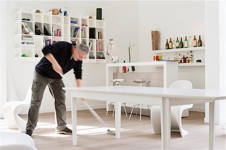 floor cleaning - Man mopping the floor Stock Photo - Premium Royalty-Free, Code: 6108-06166257