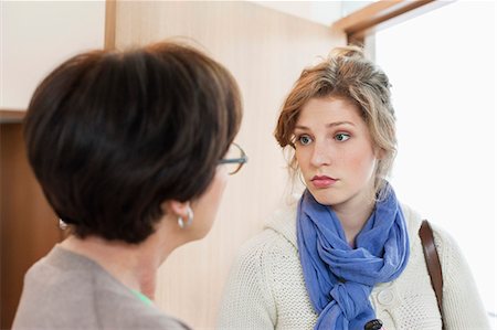 Woman talking to her mother Stock Photo - Premium Royalty-Free, Code: 6108-06166353