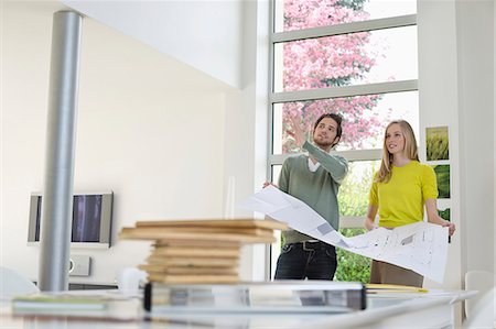 engineering drafting table images - Interior designer discussing plan with a woman Stock Photo - Premium Royalty-Free, Code: 6108-06166463