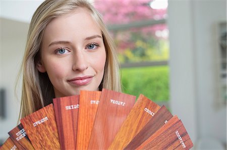 Woman holding laminated boards Stock Photo - Premium Royalty-Free, Code: 6108-06166471