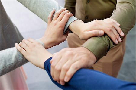 Close-up of connecting hands of business executives Foto de stock - Sin royalties Premium, Código: 6108-06166584