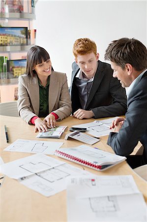 partnership - Real estate agent discussing property documents to his clients Stock Photo - Premium Royalty-Free, Code: 6108-06166526