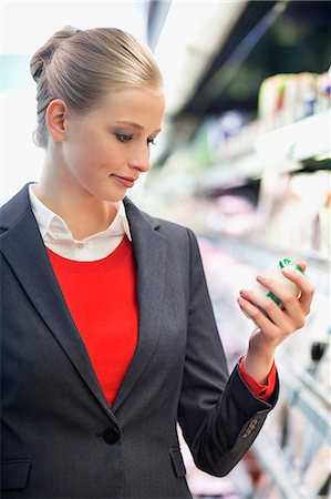 Woman shopping in a supermarket Stock Photo - Premium Royalty-Free, Code: 6108-06166666