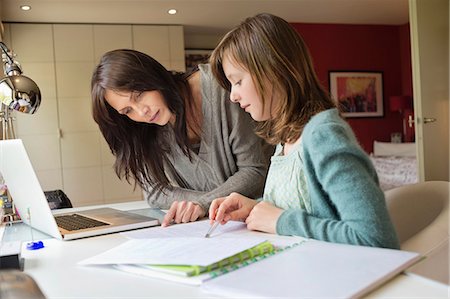 female students - Girl studying with her mother at home Stock Photo - Premium Royalty-Free, Code: 6108-06166631