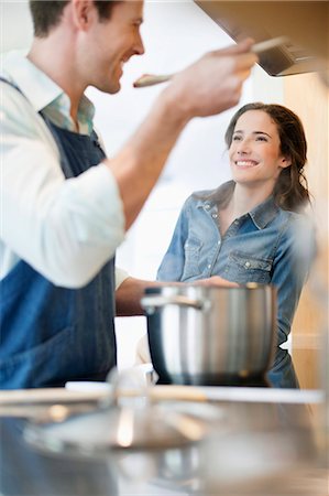 simsearch:6108-06167456,k - Couple tasting the food Stock Photo - Premium Royalty-Free, Code: 6108-06166787