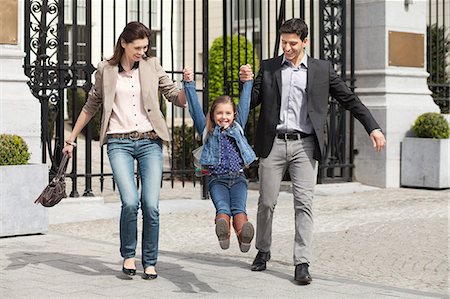 father mother child laughing white - Portrait of a girl with her parents Stock Photo - Premium Royalty-Free, Code: 6108-06166845