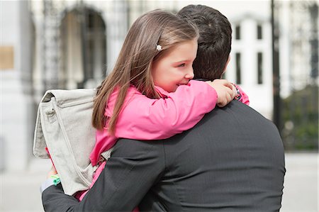 school parents - Girl hugging her father Stock Photo - Premium Royalty-Free, Code: 6108-06166850