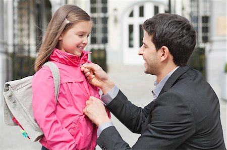 school kids holding hands - Man talking to his daughter Stock Photo - Premium Royalty-Free, Code: 6108-06166820