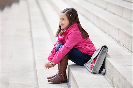 school girls brunette - Girl sitting on the steps and smiling Stock Photo - Premium Royalty-Free, Code: 6108-06167053