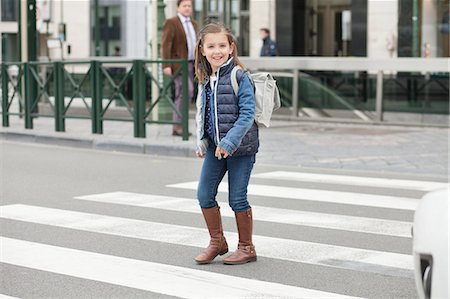 front view - Schoolgirl crossing a road Stock Photo - Premium Royalty-Free, Code: 6108-06167000