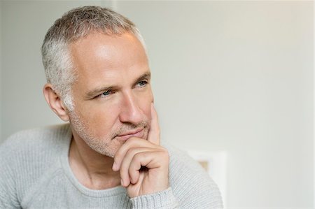 Close-up of a man thinking Foto de stock - Sin royalties Premium, Código: 6108-06167146