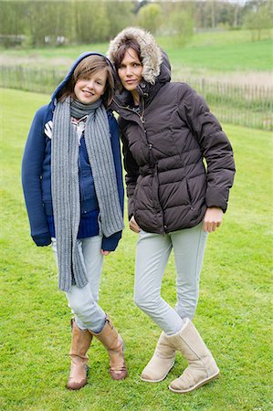 rain boots for girls - Woman with her daughter standing in a field Stock Photo - Premium Royalty-Free, Code: 6108-06167197