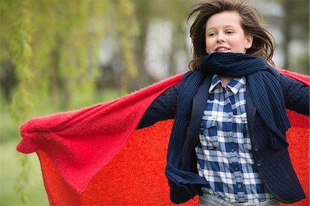 simsearch:6108-06167259,k - Girl holding a blanket with her arm outstretched Stock Photo - Premium Royalty-Free, Code: 6108-06167272