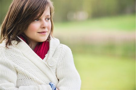 Girl thinking in a park Stock Photo - Premium Royalty-Free, Code: 6108-06167276