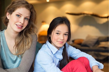 Portrait of a woman smiling with her daughter Stock Photo - Premium Royalty-Free, Code: 6108-06167475