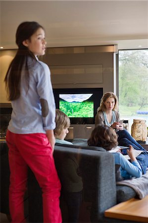 parents and children watching television - Family in a living room Stock Photo - Premium Royalty-Free, Code: 6108-06167485