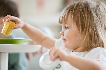 female toys - Close-up of a girl playing with toys Stock Photo - Premium Royalty-Free, Code: 6108-06167415