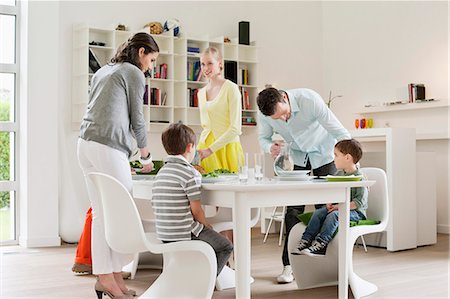 dining, table - Family at dining table with guests Stock Photo - Premium Royalty-Free, Code: 6108-06167439