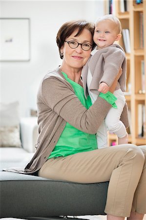 senior and baby - Woman playing with her granddaughter Stock Photo - Premium Royalty-Free, Code: 6108-06167617