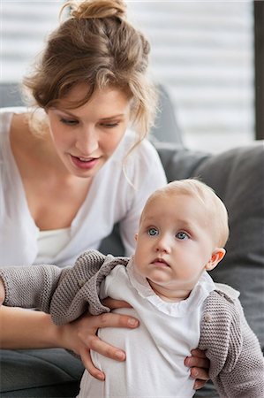 stand sofa - Close-up of a woman with her daughter Stock Photo - Premium Royalty-Free, Code: 6108-06167755