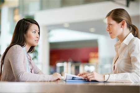 Businesswomen working in an office Stock Photo - Premium Royalty-Free, Code: 6108-06167910